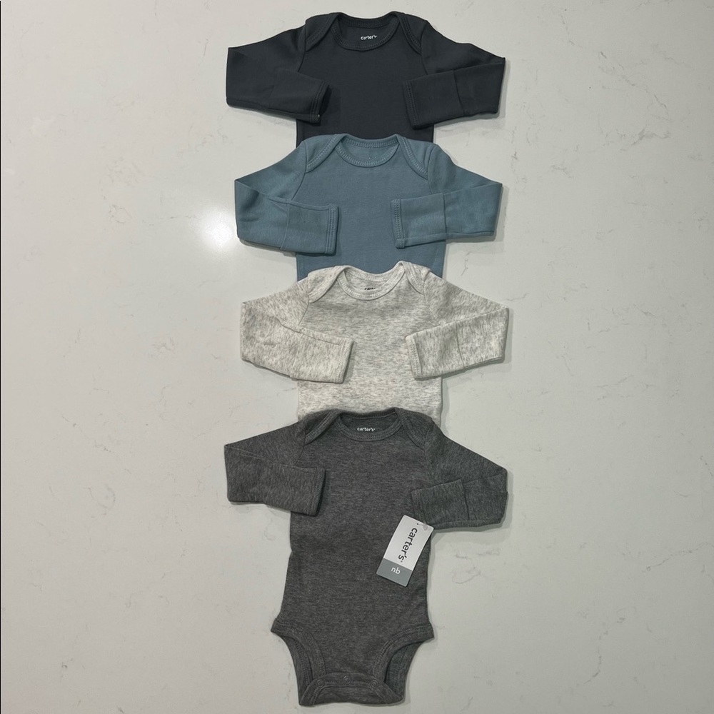 New with tags. Carter’s Long Sleeve Onesie Set in Size Newborn.
